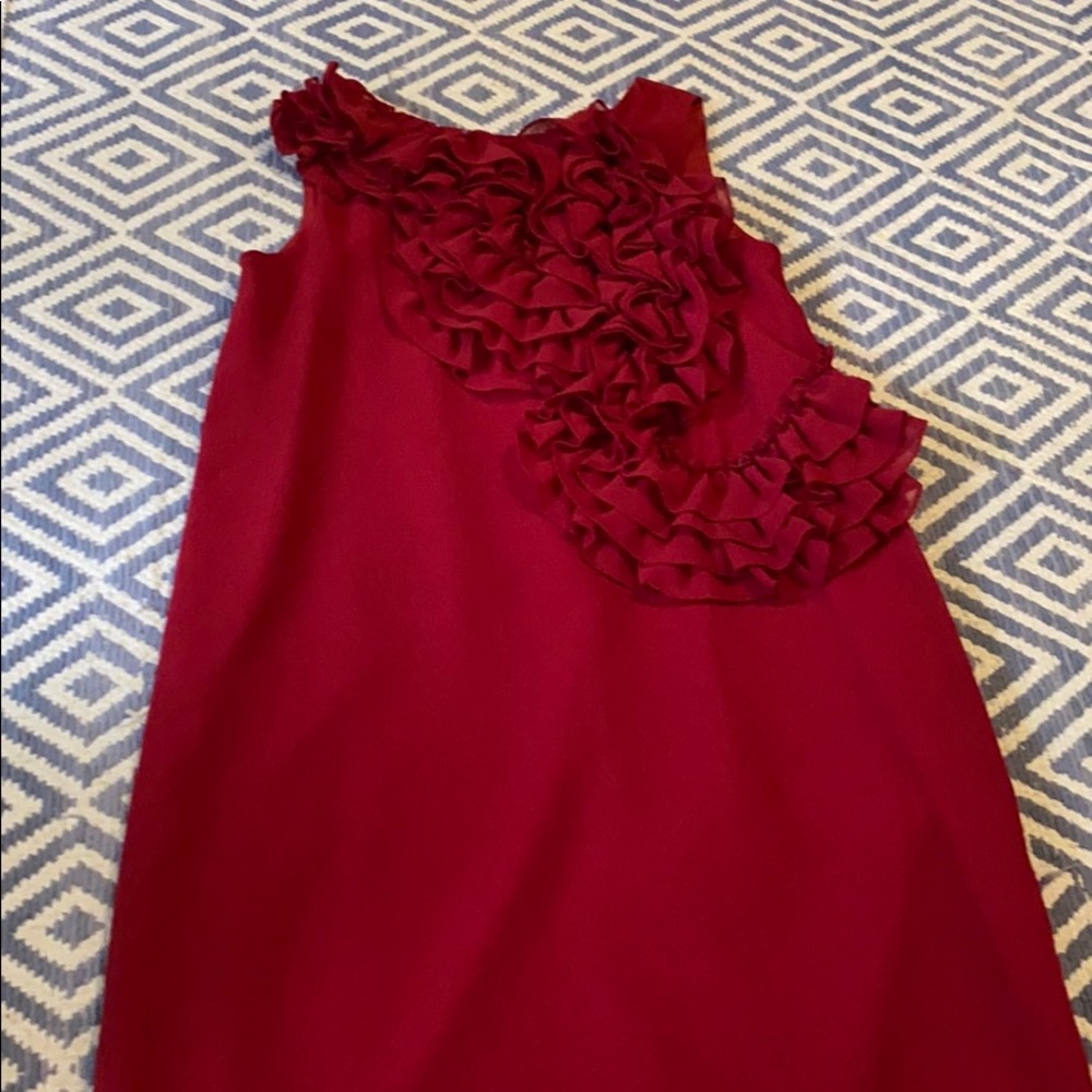 Red dress with ruffles on one side